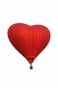 Hot air balloon flying over white background