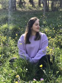 Portrait of beautiful woman on field