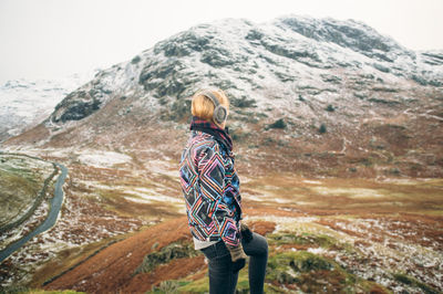 Woman standing on mountain