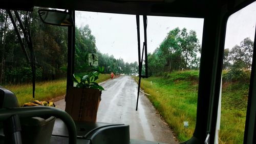 Cropped image of car on road