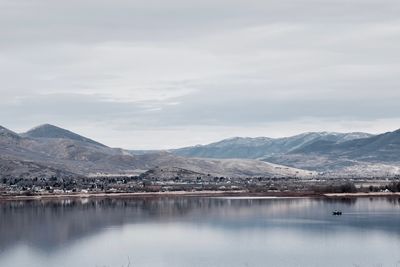 Scenic view of lake against mountain range