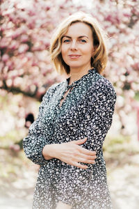 Portrait of woman standing outdoors