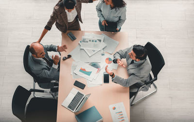 High angle view of business colleagues working in office