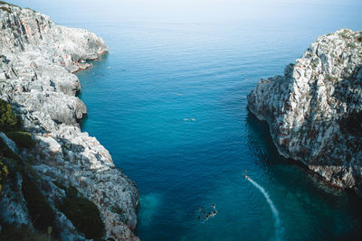 High angle view of rocks by sea