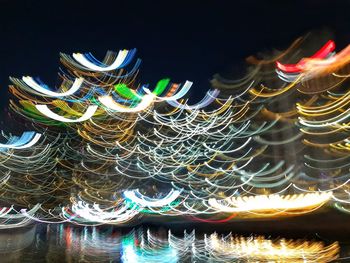 Close-up of multi colored light painting at night