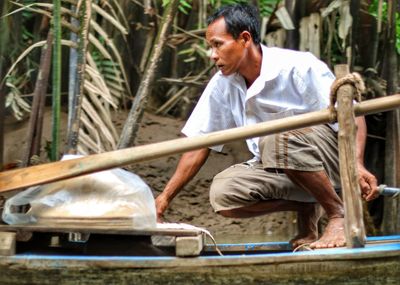 Side view of a man working