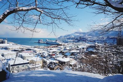 View of town against sky during winter