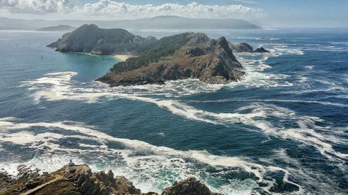 Aerial view of sea and mountain against sky