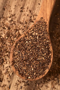 High angle view of dry leaf on wood