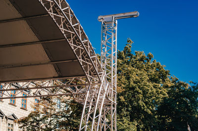 Metal trusses. metal structures for stage installation. blue sky background.