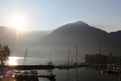 Sailboats in lake at sunset