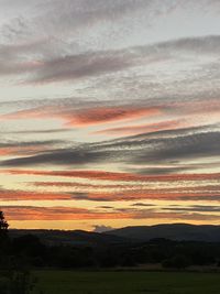 Scenic view of dramatic sky during sunset