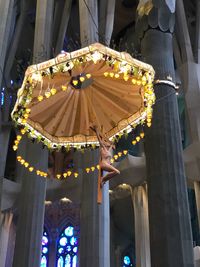 Low angle view of illuminated lanterns hanging outside building