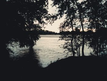 Scenic view of lake at sunset