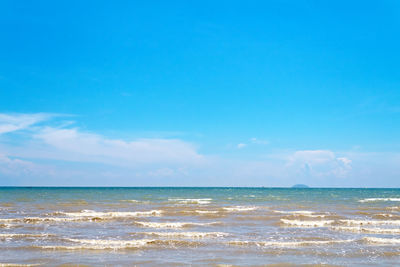 Scenic view of sea against blue sky