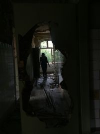 People standing in abandoned building