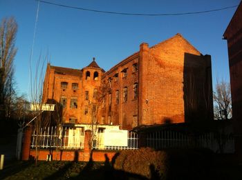 Low angle view of building against blue sky