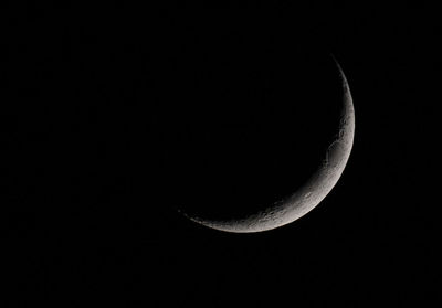 Low angle view of moon against sky at night