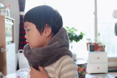 Portrait of boy looking at home