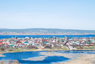 Scenic view of beach against clear blue sky