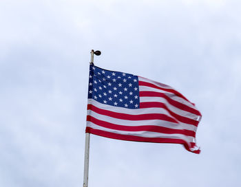 Low angle view of flag against sky