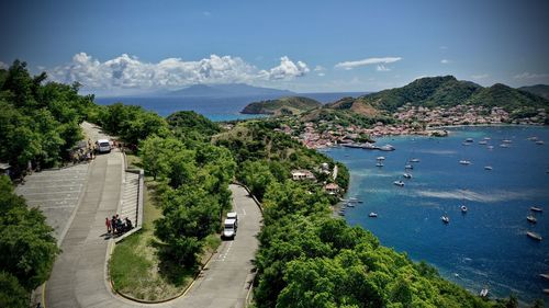 High angle view of road by sea against sky