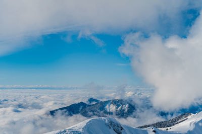 Scenic view of snowcapped mountains against sky