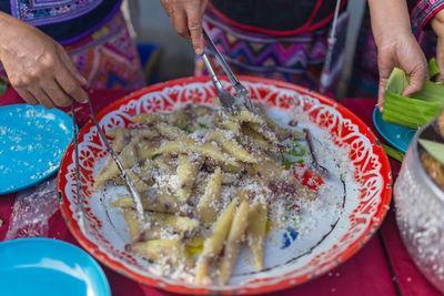 Midsection of woman preparing food