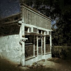 Old building with trees in background