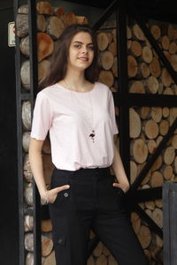 Portrait of young woman standing outdoors