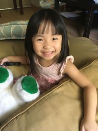 Portrait of smiling girl at home