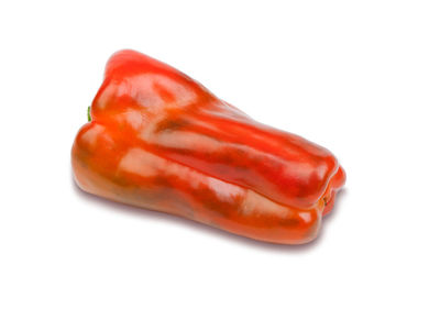 Close-up of red chili pepper against white background