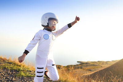 Man standing on field against clear sky