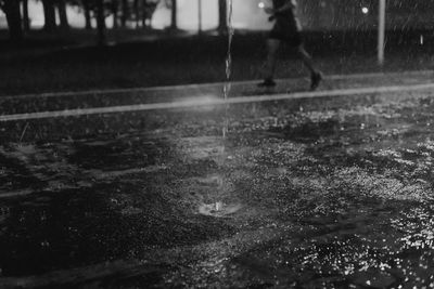 Man playing in rain