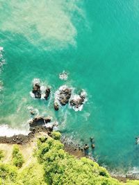 High angle view of rocks by sea