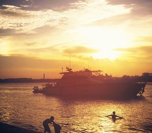 Silhouette of boat at sunset