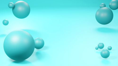 Close-up of balloons against blue background