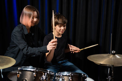 Portrait of man playing drum