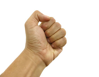 Close-up of human hand against white background