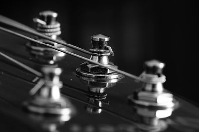 Close-up of guitar on table