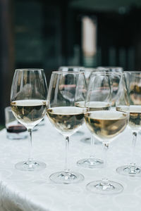 Close-up of wine glasses on table