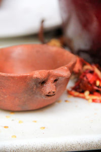 Close-up of orange slice in plate on table