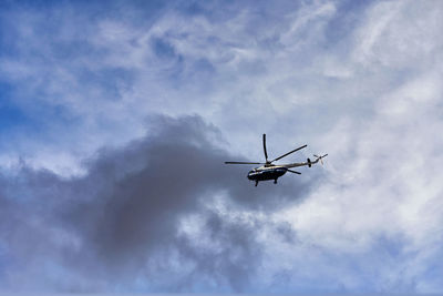 Low angle view of airplane in sky