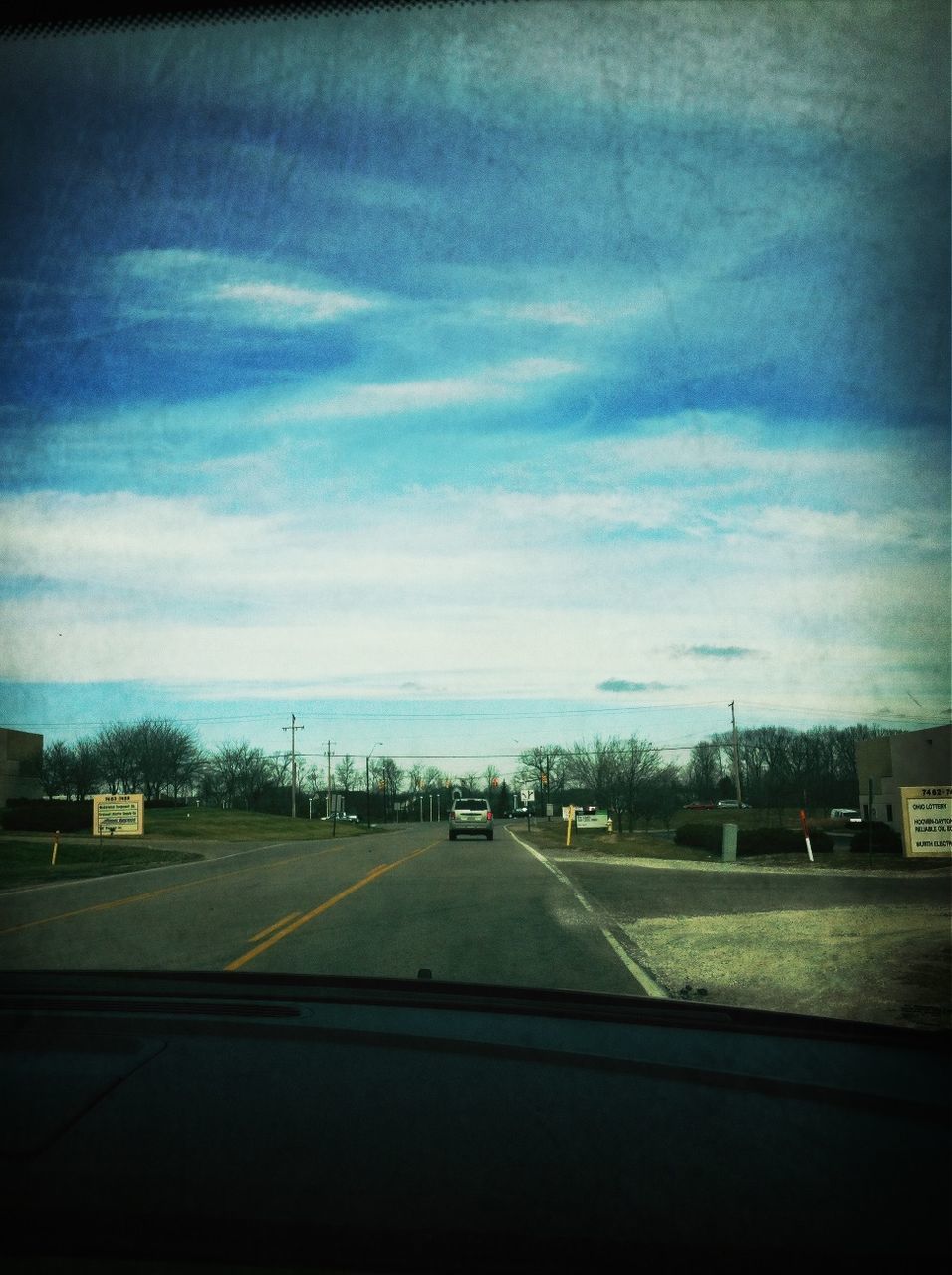 transportation, road, sky, road marking, cloud - sky, the way forward, car, street, mode of transport, cloudy, cloud, empty, diminishing perspective, land vehicle, vanishing point, outdoors, no people, day, building exterior, nature