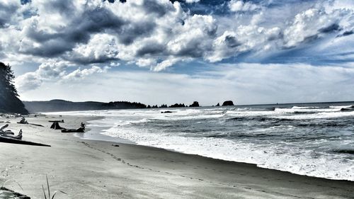 Scenic view of sea against cloudy sky