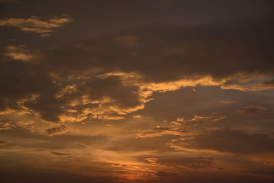 Low angle view of dramatic sky during sunset