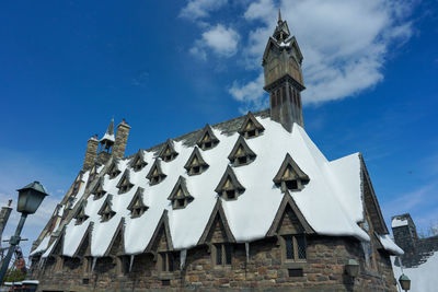 Low angle view of traditional building against blue sky