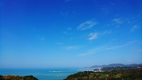 Scenic view of sea against blue sky