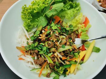 High angle view of chopped vegetables in bowl on table