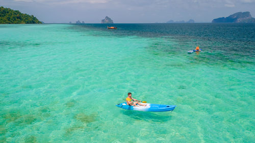 People swimming in sea